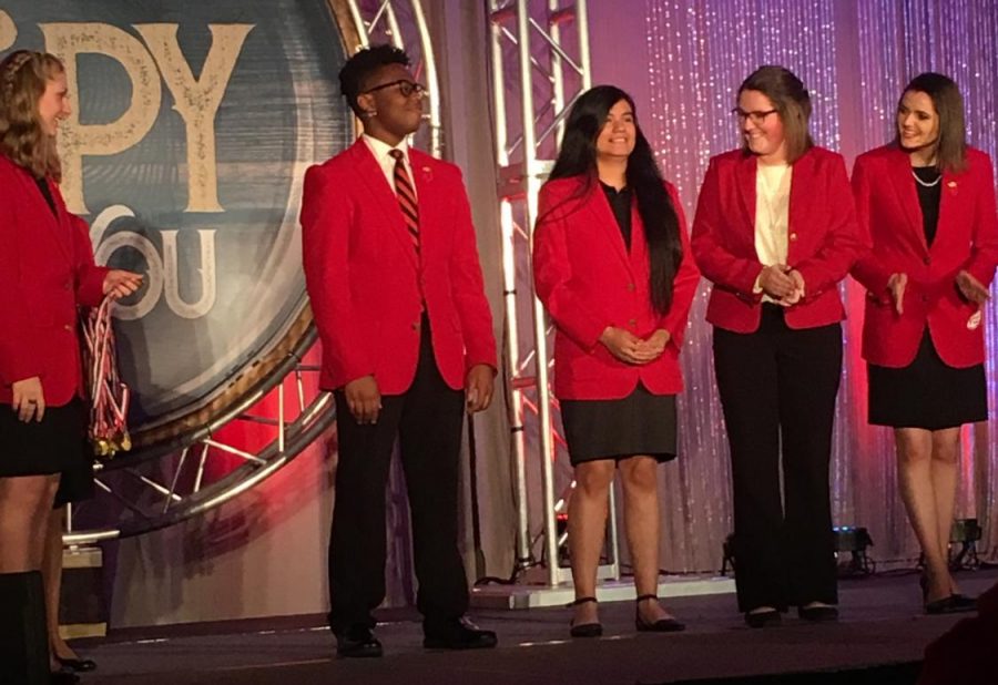 Maria Perez-Lopez, seen in the middle of the five,  stands with the rest of her FCCLA team.