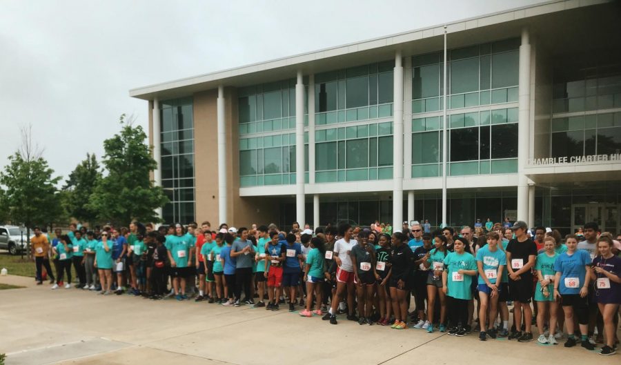 Runners lining up at the start line of the Cox Trot on Saturday, May 11.