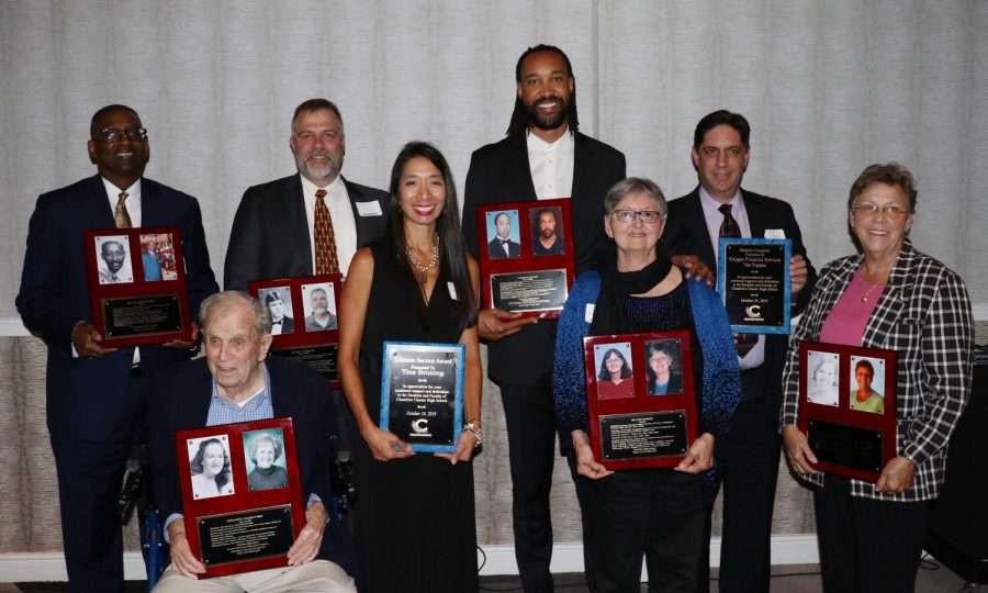 Inductees+and+award+recipients+pose+for+a+picture+at+the+Blue+and+Gold+Hall+of+Fame.