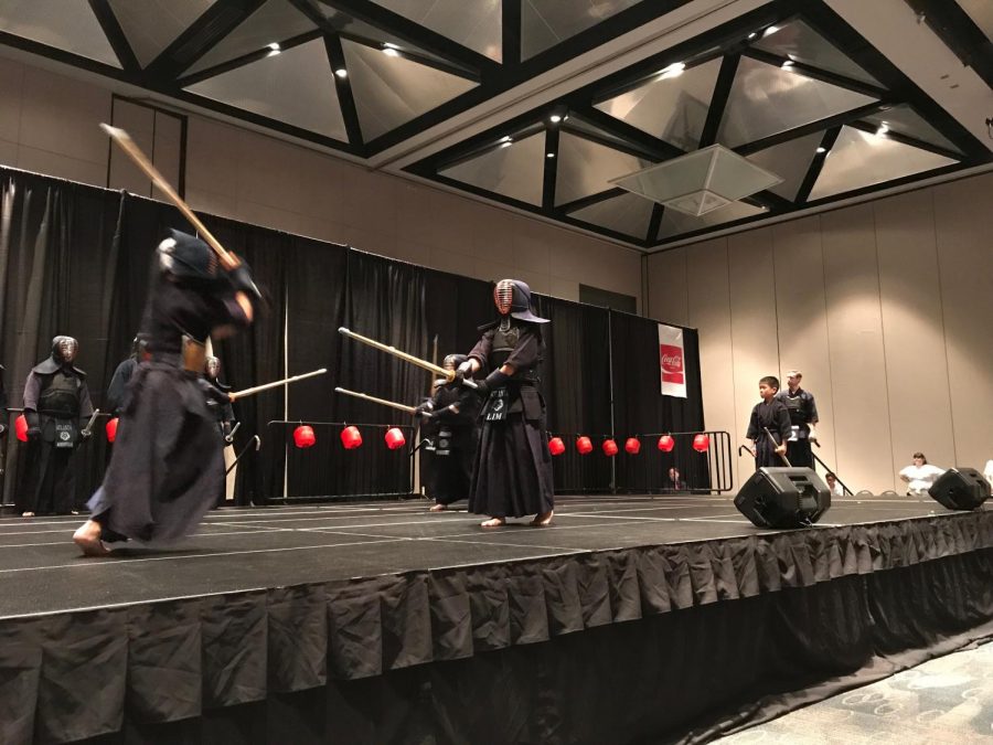 Victor Lim (right) during a kendo match. 