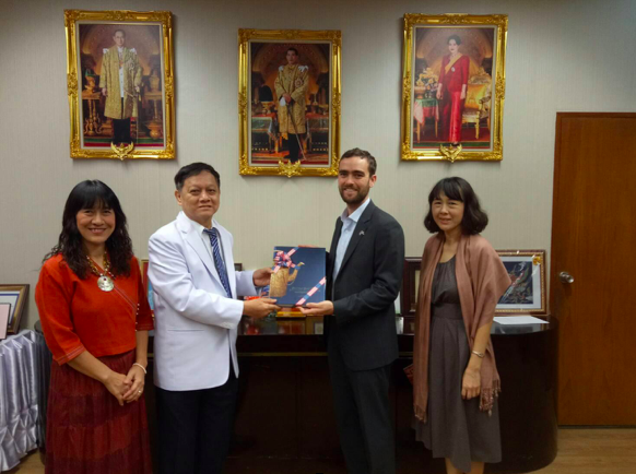 Daniel Jacobs-Nhan (second from right) meets with medical officials from the Thai government. 