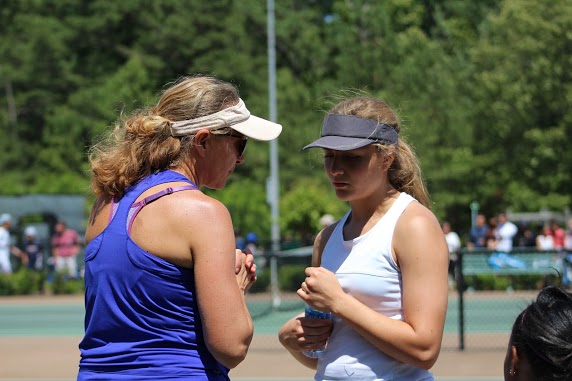 Tennis Coach Larisa Tulchinsky (left) and her daughter prepare for a tennis match. 