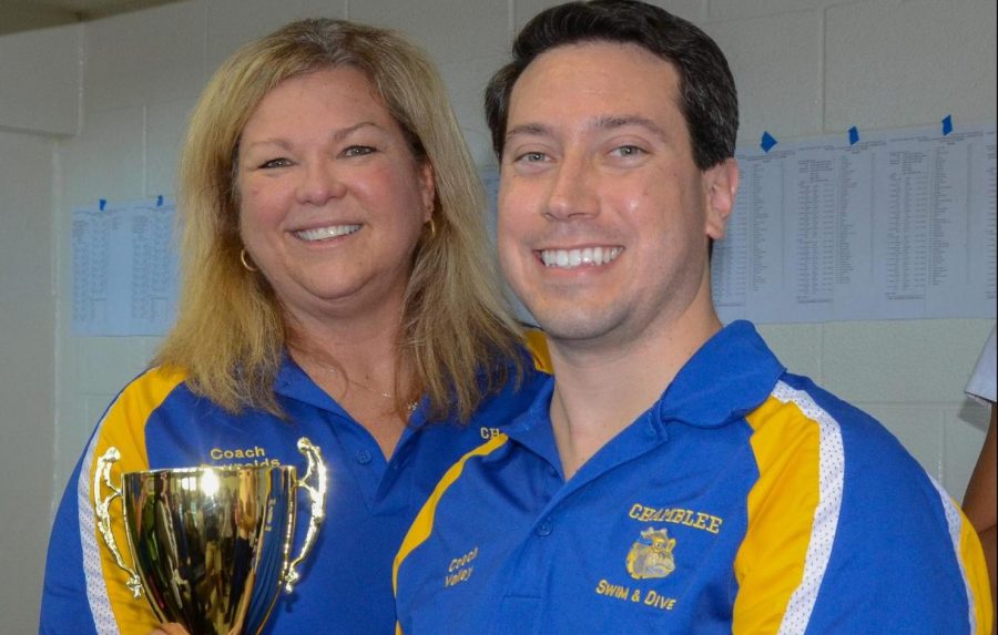 Gregory Valley poses with Lorri Reynolds, while receiving a state swim trophy.