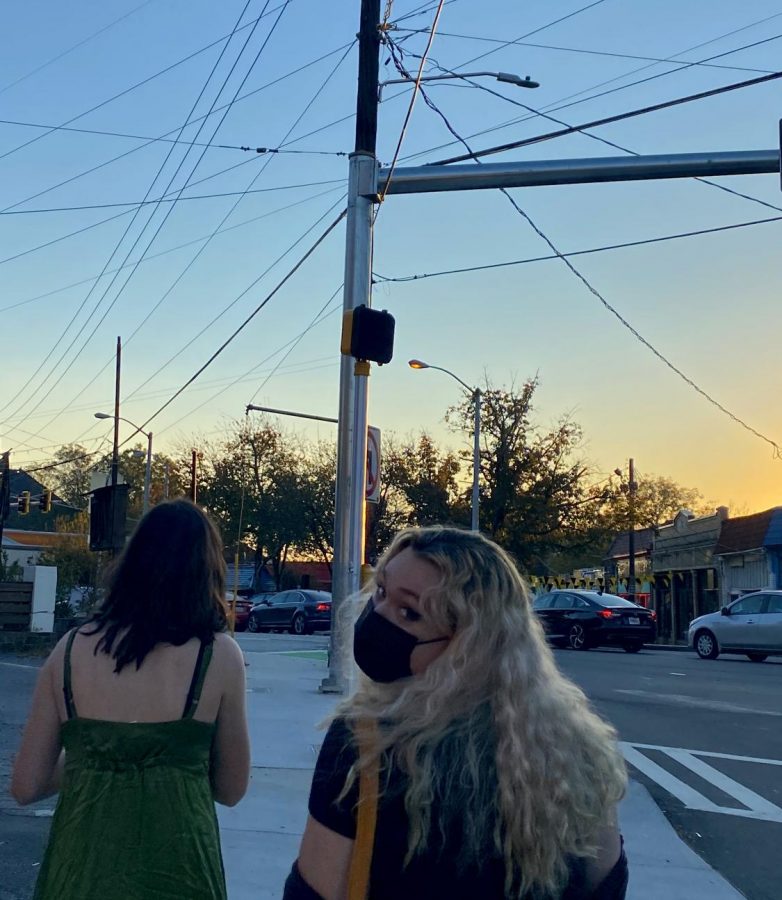 Stella Garrett (21) and Brooke George (21) enjoy an evening outing in Atlantas Little Five Points.