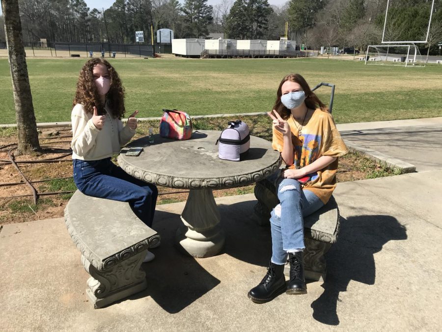 Olivia Grove (left) and Anya Bowers, both Class of 24, pause during A lunch to pose. Its strange to be back at school, said Grove, but both she and Bowers said they felt safe and that in-person classes had gone well. 