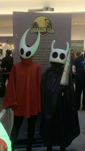 Two Dragon Con 2021 attendees cosplaying as character from the video game Hollow Knight