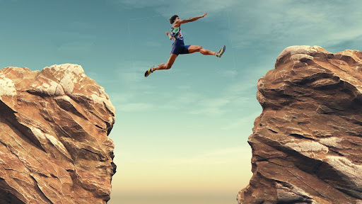A long jumper leaps over a chasm