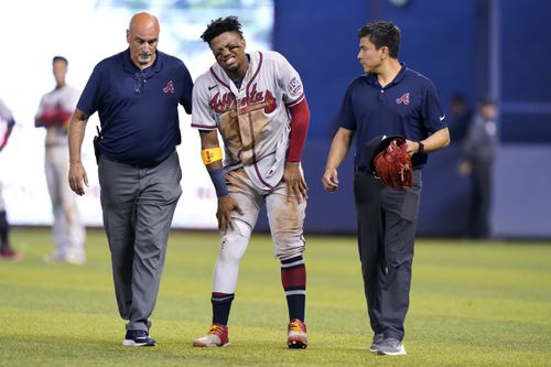Ronald Acuña Jr. limps off the field after tearing his ACL