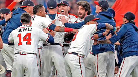 The Atlanta Braves celebrate immediately after beating the Los Angeles Dodgers to advance to the World Series
