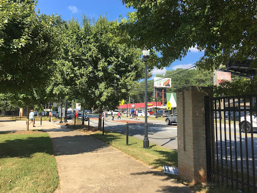 Students walking across the street without the red light flashing