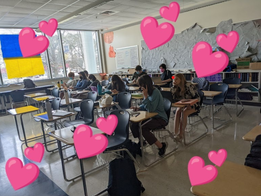 Love is in the air? Students sit in seats in hopes of scoring points for the teacher.