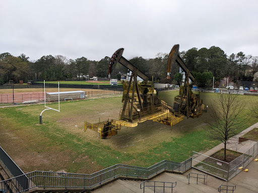 Oil rigs pumping black gold, Texas tea at the former practice field