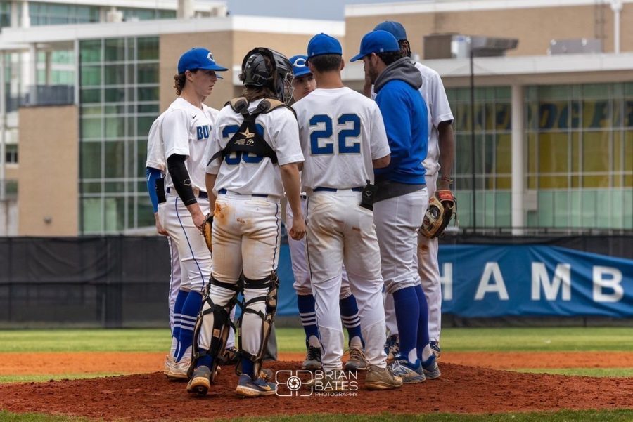 CHS+baseball+players+come+together+for+a+team+huddle.+