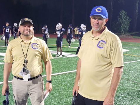 Chamblee football coaches pose in front of the classes