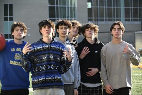 The senior boys kickball team poses for a picture.