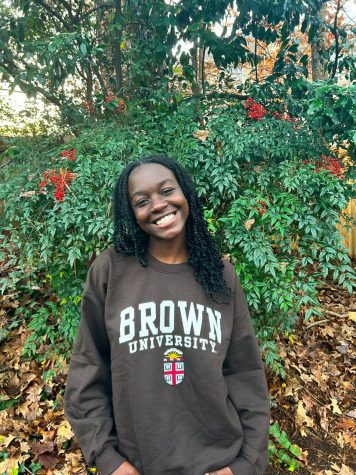 Annan celebrates her acceptance with new Brown University swag. 