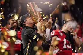 Kirby Smart kissing the National Championship trophy after Georgia win, courtesy of AP News. 