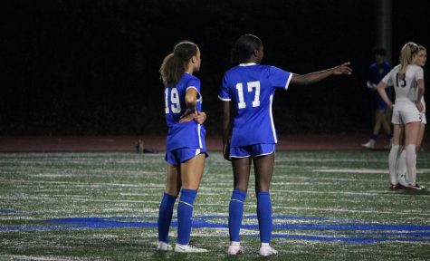 Solai Washington and Kara Croone map out game strategies on Friday night. 