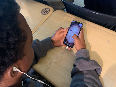 Naffi Tadesse (‘25) enjoys the opening track “Rich Flex” in school. 
(Photo courtesy of Ryan Joshi)