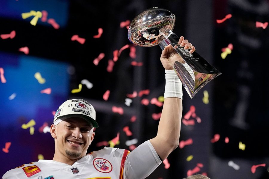 Super Bowl MVP Patrick Mahomes of the Chiefs lifts the Vince Lombardi Trophy (Photo by Brynn Anderson/AP)