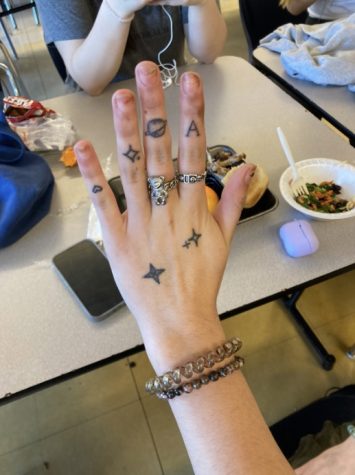 Photo Courtesy of the Blue and Gold. Ava Deljou’s (23) hand tattoos
