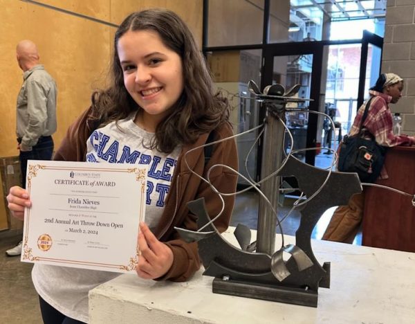 Frieda Nieves (‘25) with her metalworking art piece which won first place. Photo courtesy of Frieda Nieves