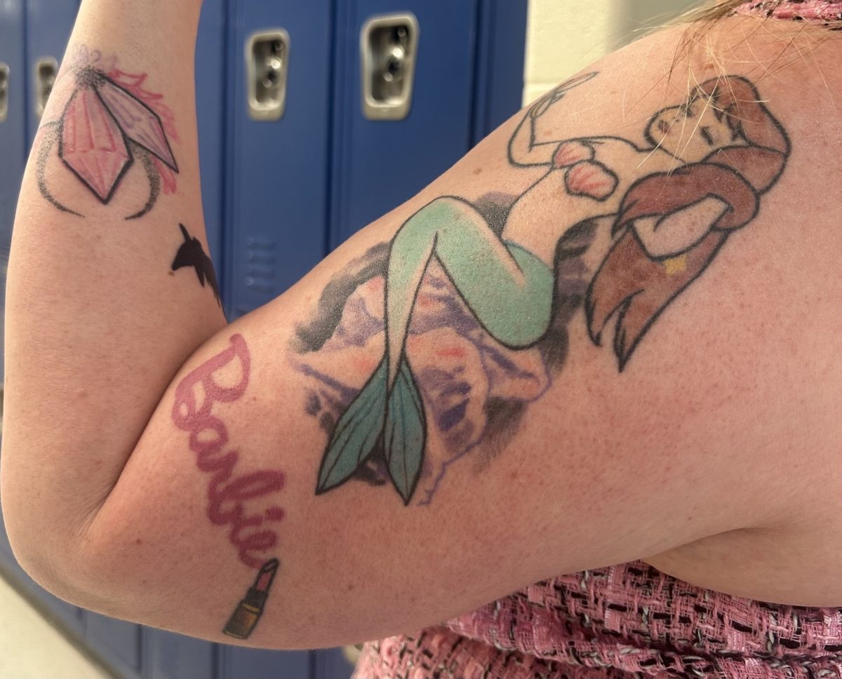 Brooke Arrington flexes her favorite tattoo.