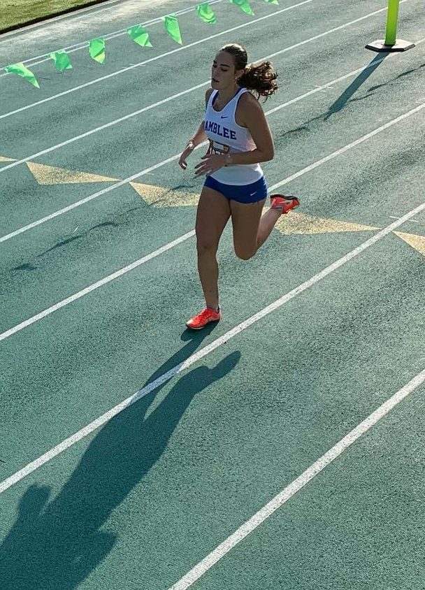 Chamblee Cross Country runner Shea Fagan ('25) crosses the finish line at the Kosh Classic August 17. Photo Courtesy of @chambleexc Instagram