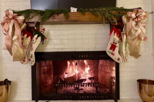 A cozy fireplace with stockings and an elf. Photo courtesy of Michael Bryant.