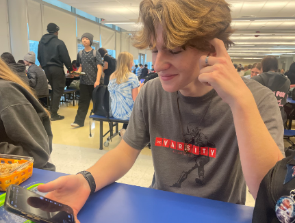 Mack Williams scrolling on TikTok after the ban was revoked (Photo Courtesy of Juliet Gonzalez)