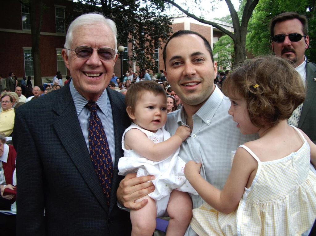 James Demer and his daughters with Jimmy Carter at a UGA graduation (Photo courtesy of James Deemer)