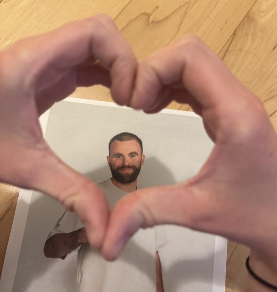 The author making a heart around her favorite cast member of Love on the Spectrum, Connor Tomlinson. Photo Courtesy of Finley Malone.

