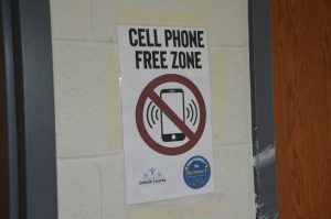 A "Cell Phone Free Zone" poster. Photo by Michael Bryant ('26).