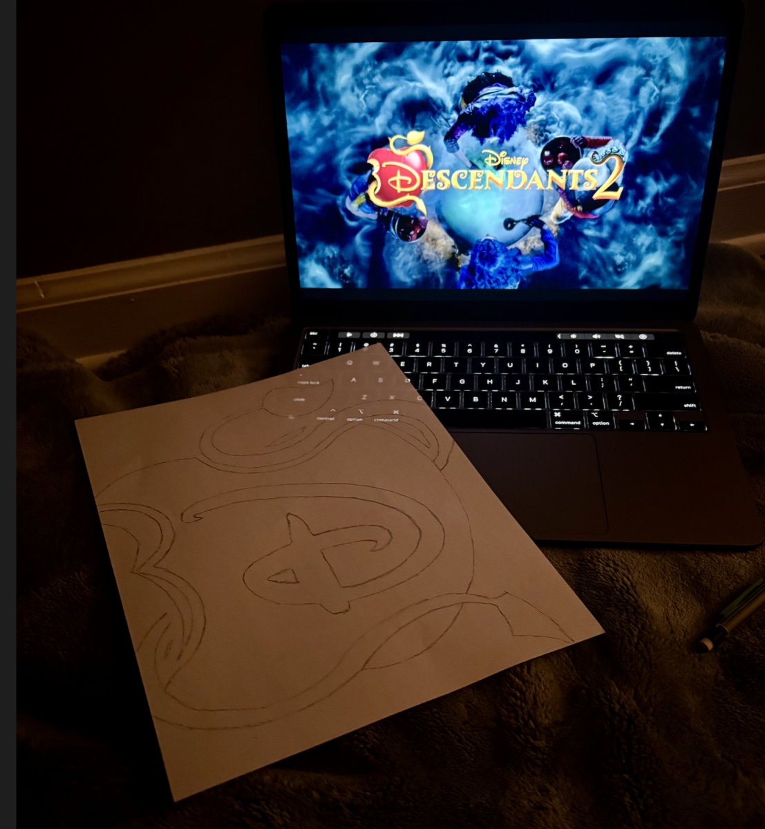 The author watching Descendants 2 while drawing. Photo courtesy of Rachel Belknap.