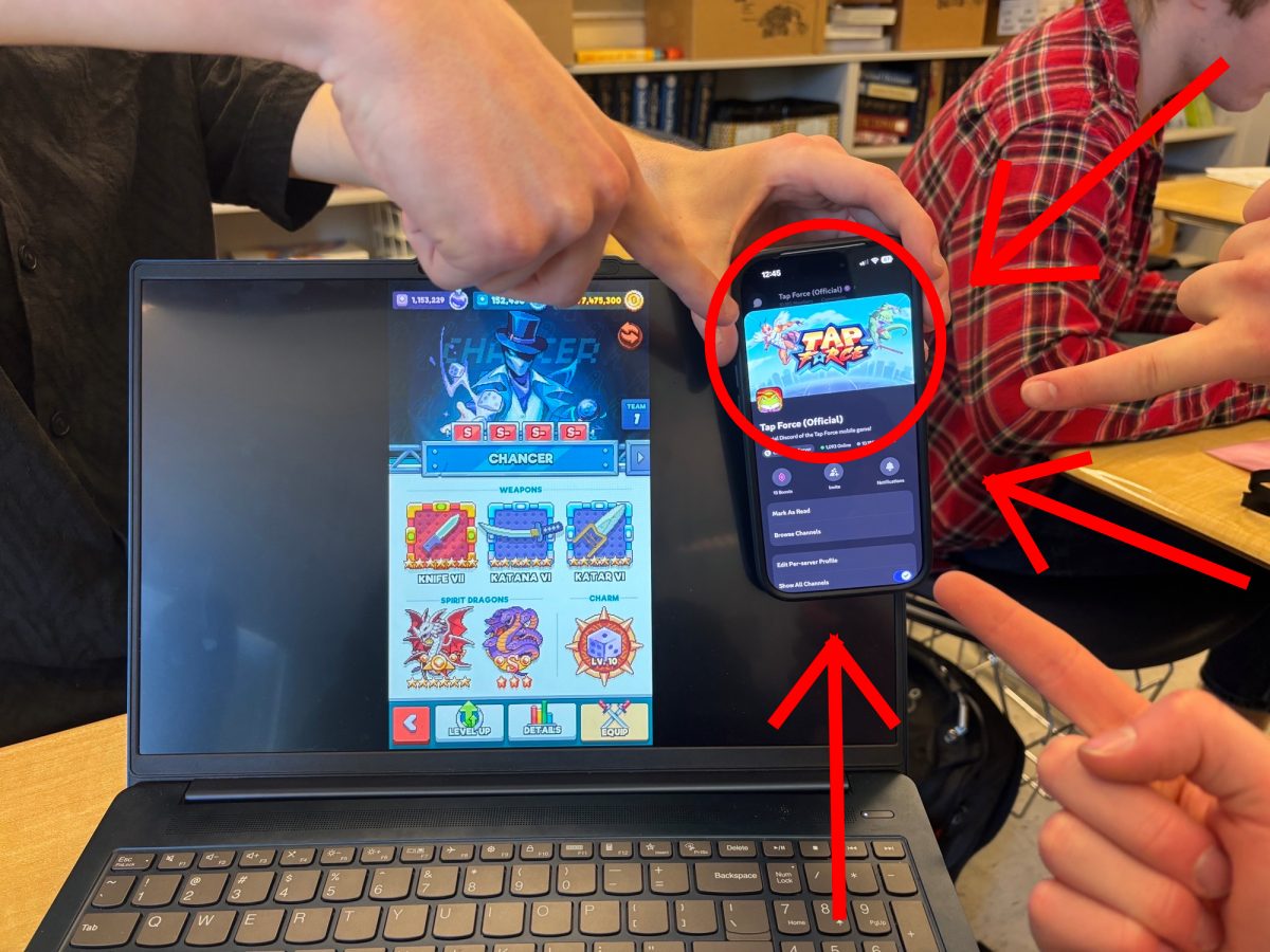 Michael Bryant ('26) showing off his Grandmaster Chancer and the Tap Force Discord server. Photo by Patrick Shaw.