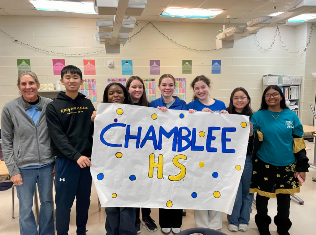 The Chamblee Reading Bowl team celebrating their win. 
From left to right: Ms. Christine Holland, Luke Kim ('29), Trinity Coachman ('29), Claire Otte ('28), Julianne Lee ('27), Noelle LaMarca ('26), Maya Heffernan ('28), Samia Eva ('27).
Photo Courtesy of Julianne Lee.