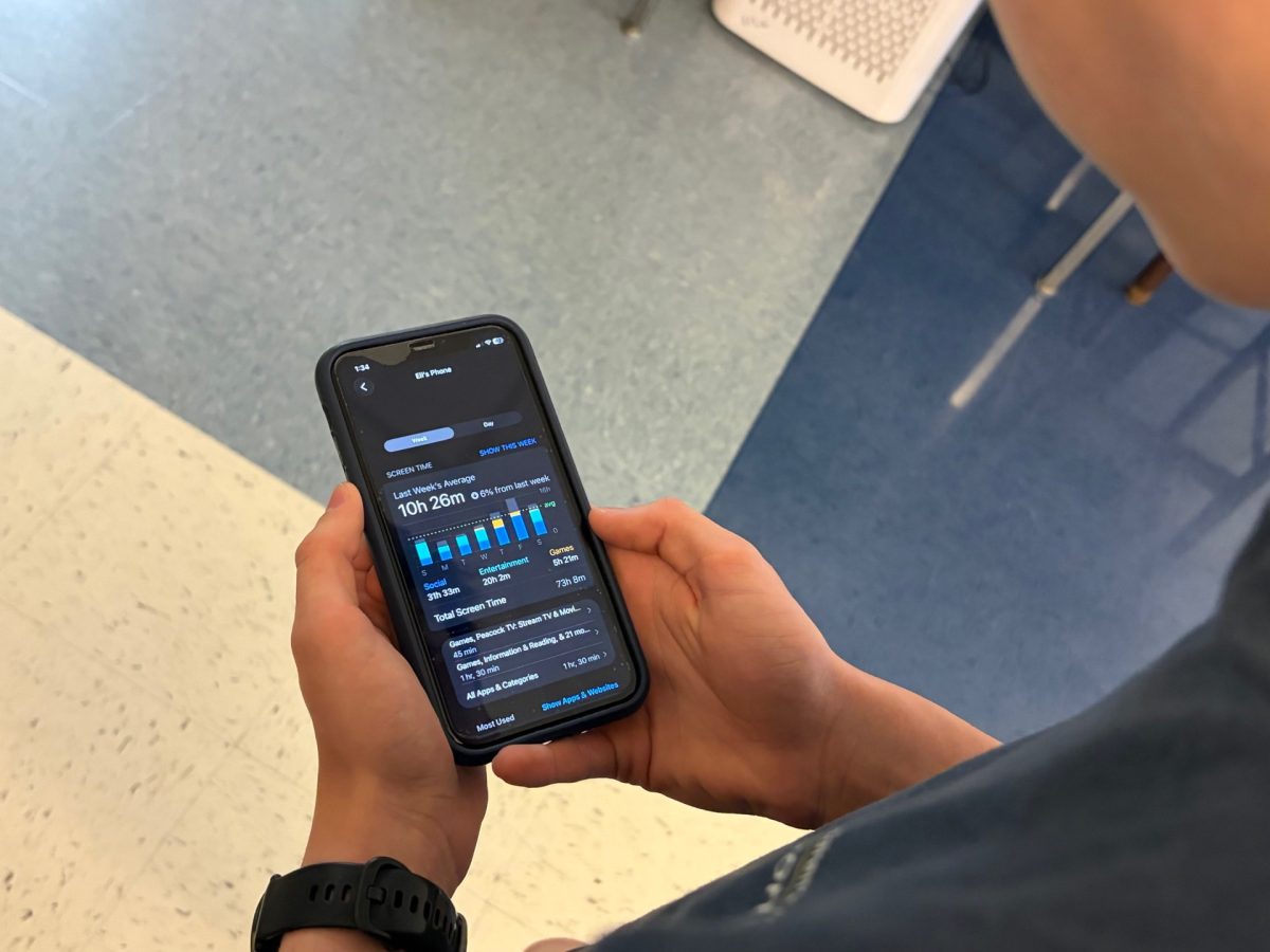 A student showing his screen time. Photo by Seth Weiss.