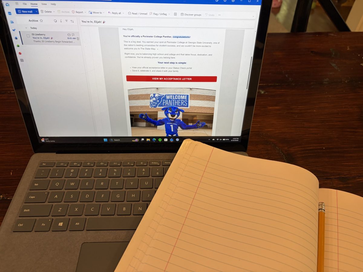 Eli prepping for Dual Enrollment after receiving his GSU acceptance email. Photo by Eli Lineberry.