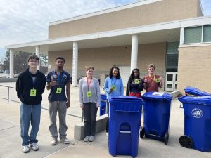(Left to right) Jackson Warren (‘26), Isaac Agbossoumonde (‘26), Vivian Shoemaker (‘28), Makayla Huang (‘28), Meah Griffin (‘27), and Mack Williams (‘27) with recycling cans in Bulldog Plaza. Photo by Noa Zilber.